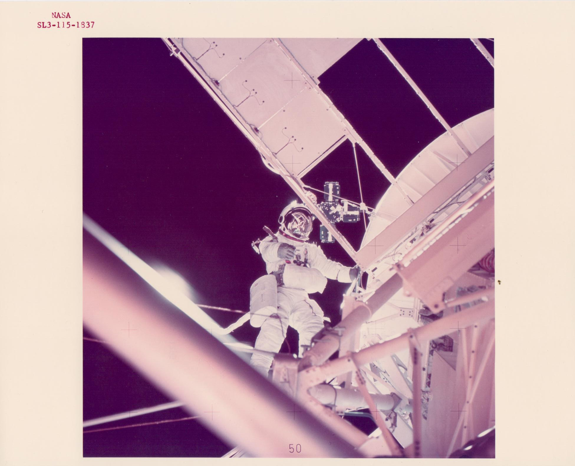 Owen Garriott working outside the spacecraft, Skylab 3, August 1973