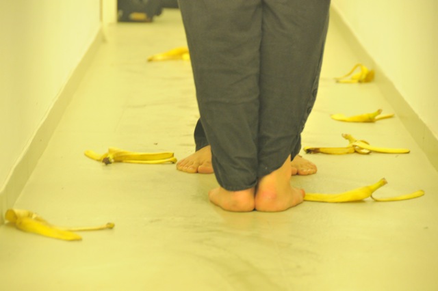 SLIPPING ON EGOS, action, 2011, performers Mihai Dragomir, Marina Albu, concept Marina Albu The content of the bananas was sliced up and served to the audience on a plate, accompanied by the message “Eat My Ego on a Stick”